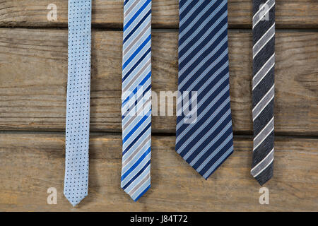 Overhead view of neckties on wooden table Stock Photo