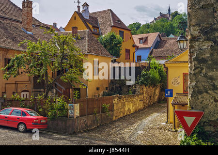 Sighisoara, Romania - July 26, 2014: Old residential district in the historic center of Sighisoara, one of the few still inhabited citadels in Europe. Stock Photo