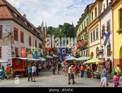 Sighisoara, Romania - July 26, 2014: People come to colorful traditional craft market in the citadel of Sighisoara. Stock Photo