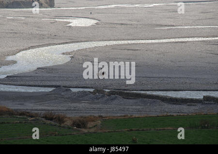 asia ravine river bed nepal mustang himalayas travel stone horse hike go hiking Stock Photo