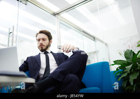 Professional salesman or trader working in office Stock Photo
