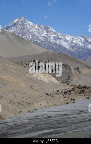 asia ravine river bed nepal mustang himalayas blue travel religion culture Stock Photo