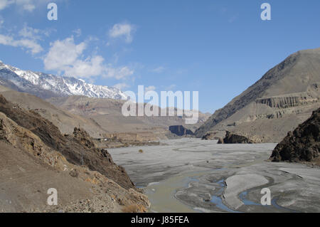 asia ravine river bed nepal mustang himalayas blue travel stone hike go hiking Stock Photo