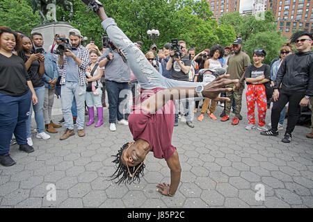a fit African American dancer performing in a contest for exposure on an internet broadcast. In Union Square Park in new York City. Stock Photo