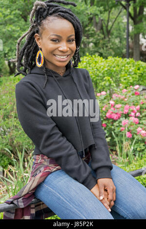 Posed portrait of a beautiful 20 year old Nigerian American dancer taken in Union Square Park in Manhattan, New York City. Stock Photo