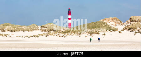 Strollers on the beach, lighthouse, Amrum, North Frisian Islands, Schleswig-Holstein, Germany Stock Photo