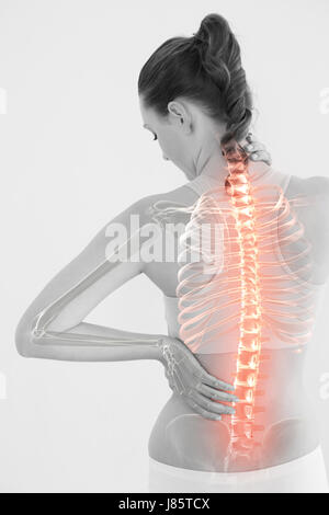 Digitally generated image of woman suffering from muscle pain against white background Stock Photo