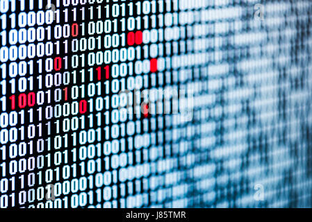 Red bits figuring data corruption in a sequence of bits on a screen Stock Photo
