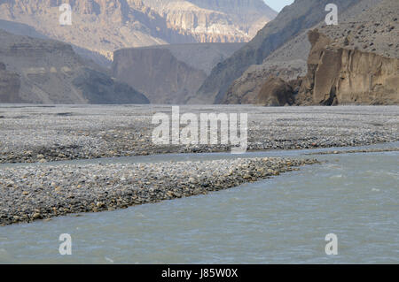 asia ravine river bed nepal mustang himalayas blue travel stone hike go hiking Stock Photo