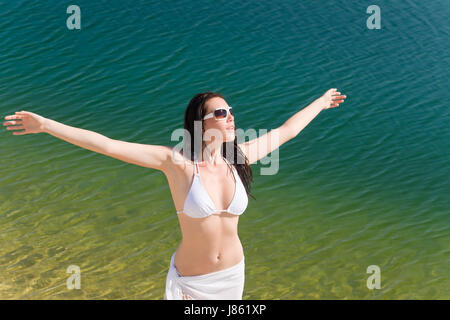 Woman bikini sarong beach happy hi-res stock photography and