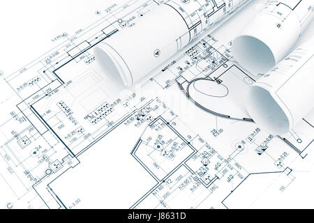 architectural background with rolls of technical drawings and blueprints Stock Photo