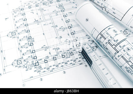 architects workplace with project plans, rolled blueprints and folding ruler Stock Photo