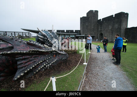 Caerphilly Castle, South Wales, UK.  27 May 2017. 2 new additions have been made to the dragon sculpture displays at the castle. 2 baby dragons have 'hatched' at castle to parents Dewi & Dwynwen.  Both baby dragons actually move.  All are the work of Cardiff based prop company, Wild Creations.  The dragons will be on display until tomorrow before moving onto Chepstow, then follows a tour of Welsh castles. Andrew Bartlett/Alamy Live News Stock Photo