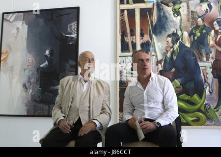 Aschersleben, Germany. 27th May, 2017. Painters Arno Rink and Neo Rauch sit next to each other at the graphic foundation Neo Rauch in Aschersleben, Germany, 27 May 2017. Painters Neo Rauch's and Arno Rink's works meet at the sixth exhibition of the graphic foundation since its establishment. Photo: Matthias Bein/dpa-Zentralbild/dpa/Alamy Live News Stock Photo