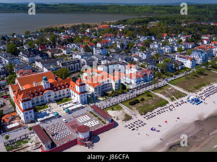 Binz, Germany. 18th May, 2017. The over 100 year old spa house with its adjoining park and the seaside promenade can be seen in Binz, Germany, 18 May 2017. Today the hotel, opened on the 3rd of July 1908, is greeting vacationers. For more than 30 million euros the 'Travel Charme Groupe' from Berlin renovated the spa house Binz. It has now been reopened as a five-star-hotel since December 2001. Aerial View Taken with a Drone. Photo: Jens Büttner/dpa-Zentralbild/ZB/dpa/Alamy Live News Stock Photo