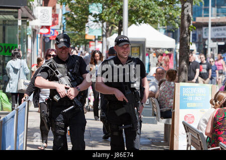 Lowestoft, UK. 24th May, 2017. Armed police officers a reassuring and friendly presence amongst Bank Holiday shoppers in Lowestoft town centre.  © Adrian Buck / Alamy Live News. Stock Photo