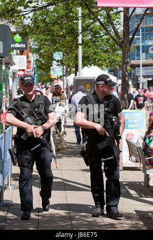 Lowestoft, UK. 24th May, 2017. Armed police officers a reassuring and friendly presence amongst Bank Holiday shoppers in Lowestoft town centre.  © Adrian Buck / Alamy Live News. Stock Photo