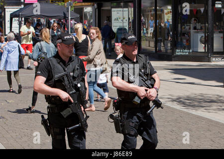 Lowestoft, UK. 24th May, 2017. Armed police officers a reassuring and friendly presence amongst Bank Holiday shoppers in Lowestoft town centre.  © Adrian Buck / Alamy Live News. Stock Photo