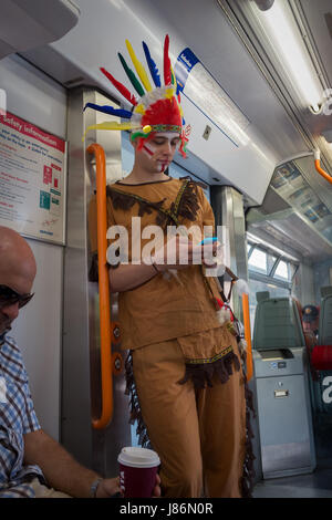 Twickenham, UK. 27th May, 2017. A fan looking incongruous among weekend travellers on the train to to the Aviva Premiership Rugby Final, Twickenham, UK between Exeter Chiefs and Wasps Credit: On Sight Photographic/Alamy Live News Stock Photo