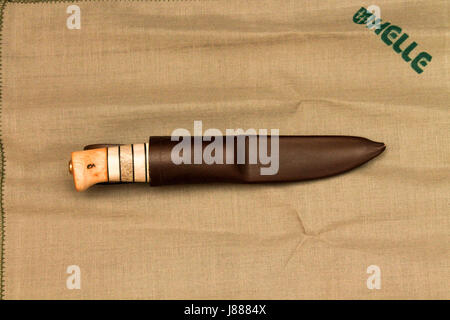 Hunting knife in leather sheath. Hunter's knife. Stock Photo