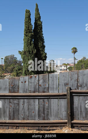 Wooden fence in front of trees in Silver Lake District of Los Angeles, California Stock Photo