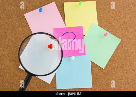 Black magnifying glass with blank notes Stock Photo