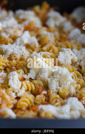 pasta dish before gratinated in the oven Stock Photo