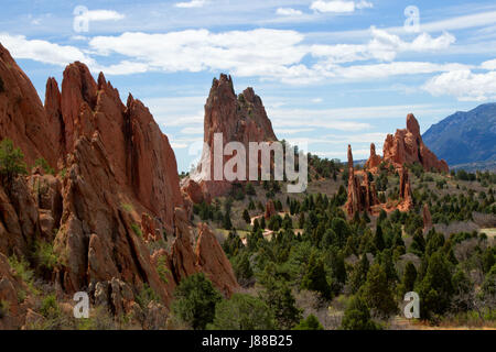 The Classic Overlook View of Garden of the Gods in Colorado Springs on a beautiful summer day with blue skies and white puffy clouds Stock Photo