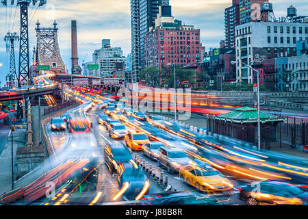 Traffic in E 59thSt & 2nd Avenue. Queensboro bridge in front in New York City Stock Photo