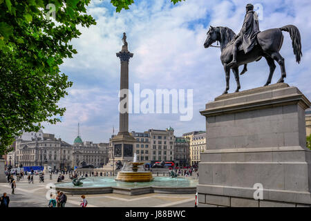 Charing Cross, London, England - May 11, 2017: Trafalgar Square, south side, with view of Nelson's Column.and fountain. Stock Photo