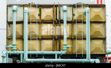Water pipe and water tank. Pumping systems for industrial works Stock Photo