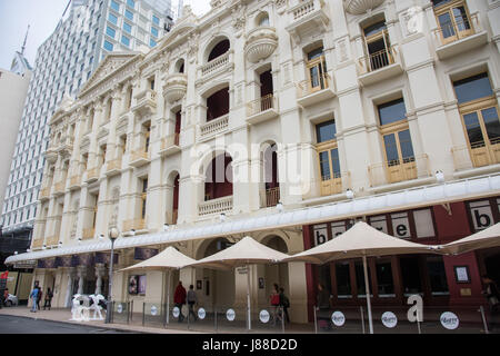 Perth,WA,Australia-November 16,2016: His Majesty's Theatre with umbrella's, cow art installation and people in downtown Perth, Western Australia. Stock Photo