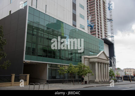 Perth,WA,Australia-November 16,2016: Downtown area with people, District Court building and skyscraper construction in Perth, Western Australia. Stock Photo