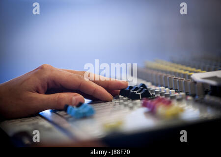 Professional audio mixing console with faders and adjusting knobs radio TV broadcasting Stock Photo