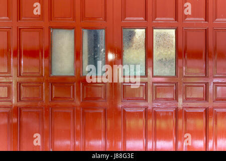 red wooden wall of traditional Thai house Stock Photo