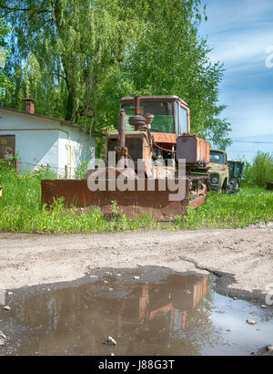 Old red crawler tractor. A close up Stock Photo