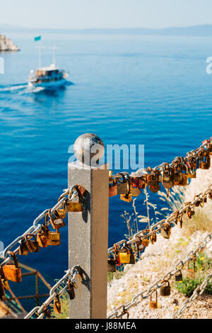 Wedding lock on the fence near the sea. Makarska, Croatia. Stock Photo