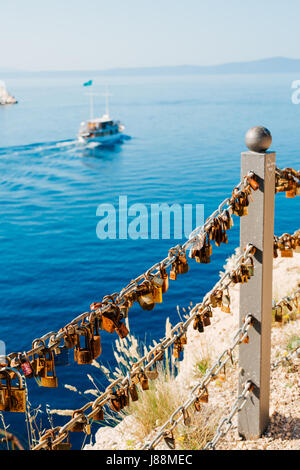 Wedding lock on the fence near the sea. Makarska, Croatia. Stock Photo