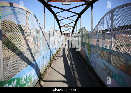Footbridge over the railway in Splott, Cardiff, Wales. Stock Photo