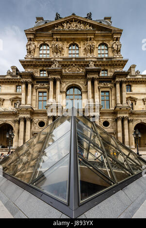 PARIS - JULY 1: Glass Pyramid in Front of the Louvre Museum on July 1, 2013. The Louvre is one of the world's largest museums in Paris. Nearly 35,000 