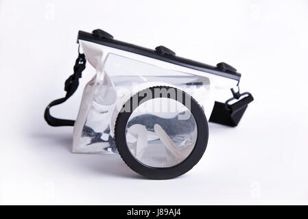 Waterproof case for digital camera on white background, summer accessory of photographer Stock Photo