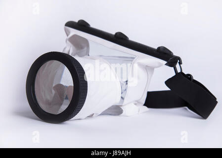 Waterproof case for digital camera on white background, summer accessory of photographer Stock Photo