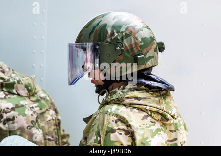 Samara, Russia - May 27, 2017: Special Forces soldier in protective helmet  with glasses and camouflage military uniform Stock Photo