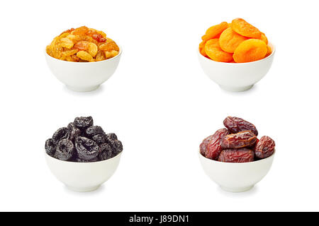 Set of bowls with dried fruits on white Stock Photo