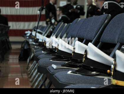 PORTLAND, Ore. (May 22, 2017) - Chief covers rest on chairs prior to the submarine tender USS Frank Cable (AS 40), change of command ceremony at the Naval Operational Support Center Portland, May 22. Capt. Jeff Farah relieved Capt. Drew St. John as commanding officer during the ceremony. (U.S. Navy photo by Mass Communication Specialist Seaman Heather C. Wamsley/Released) Stock Photo