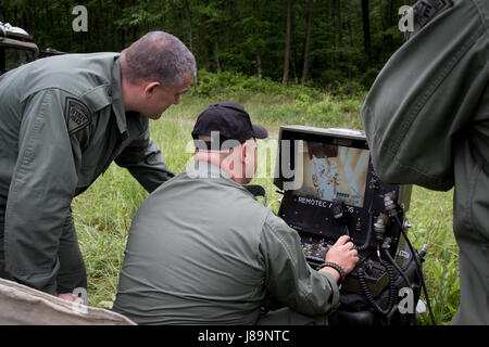 Soldiers of the 753rd Explosive Ordnance Disposal (EOD) of Kingwood, W.Va., and members of the West Virginia State Police Bomb Squad participated in a Raven's Challenge that took place at Camp Dawson, Kingwood, from May 21-26, 2017. Raven's Challenge is an annual, interagency, counter IED exercise that incorporates scenarios focused on interoperability capabilities between public safety bomb squads and military EOD units in operational domestic type IED environments. The exercise also provided international participation. (U.S. Army photo by Sgt. Penni Harris) Stock Photo