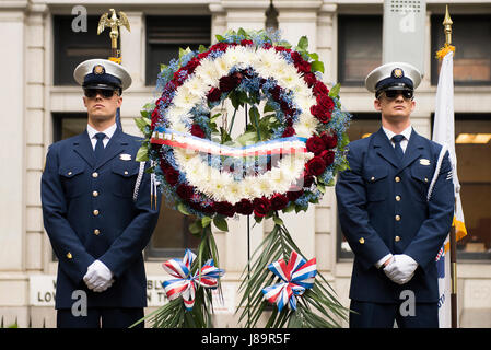 Member of the U.S. Coast Guard Silent Drill Team stand at attention at a memorial wreath-laying ceremony to honor Coast Guard founder, Alexander Hamilton, at his grave at Trinity Church in New York City, May 26, 2017. Cast members Lexi Lawson (Eliza Hamilton) and Brandon Victor Dixon (Aaron Burr) of the esteemed Broadway musical, Hamilton also attended and paid their respect to the shared namesake of the Coast Guard cutter and the musical. U.S. Coast Guard photo by Petty Officer 1st Class LaNola Stone. Stock Photo