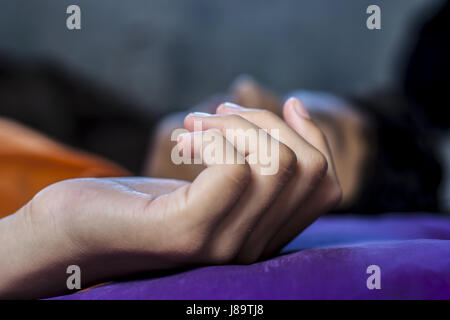 A boy's hand on a pillow. Stock Photo