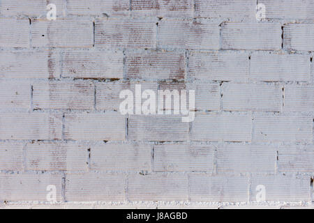 Detail of a brick wall painted in white Stock Photo
