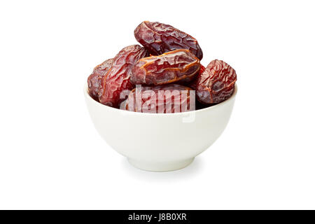 Bowl of dried date fruits on white Stock Photo